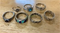 7 marked 925 sterling silver rings, one with a