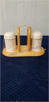 Salt and pepper shakers with napkin holder