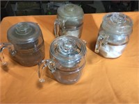 Four glass coffee pots