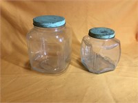Two vintage glass canisters (9” & 7”)