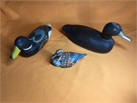 2 wooden ducks and one ceramic duck