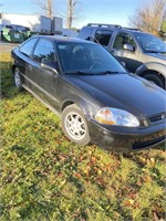97 Honda Civic. Two-door four-cylinder, five