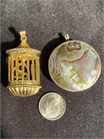 Two pendants, gold birdcage, mother of pearl