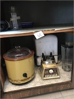 Contents in Cabinet, Crock Pot, Blender, Bread &