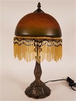 Table lamp with beaded fringe shade