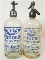 2 glass National Sparkling Water seltzer bottles