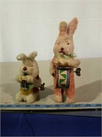 Vintage wind-up plush rabbits. One eating carrot