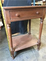 Antique wooden end table with drawer.