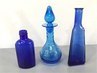 Three Blue Glass Bottles