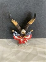 eagle with two flags below it