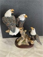 3 eagles sitting on a tree