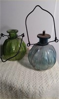 3 glass oil burning lamps. 1 has its wick