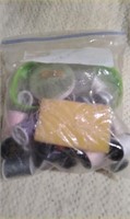bag of sewing thread, needles, thimble , safety