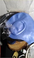 new in package: 2 swim caps and 2 sets of nose