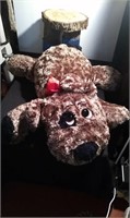 large plush puppy with red bow