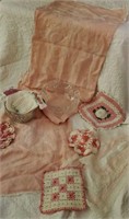 Crystal dishes, pink dresser scarves, doilies,