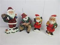 Four Santa Claus Figurines