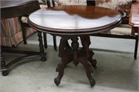 ANTIQUE OVAL CARVED LAMP TABLE