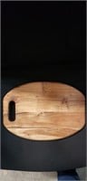 12 inch wooden cutting board with handle.