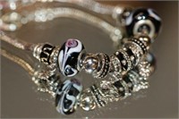 .925 Sterling charm Bracelet w/ approx 13 charms