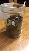 Jar of collectible Canadian pennies.