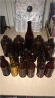 Box of 18 misc amber bottles.  One Walter Raupfer