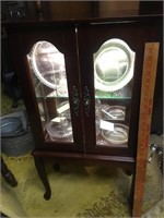 Curio cabinet with two doors, one glass shelf,
