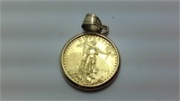 14 K gold bezel with five dollar gold liberty coin