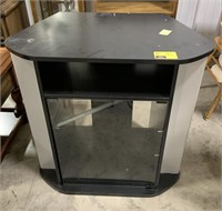 Black TV stand measures approximately 31 1/4" x