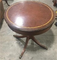 Round wooden table measuring 28x28