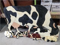 lot of wooden cow and sheep cutouts