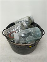Galvanized pot full of sealer bottles