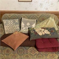 Assorted throw pillows and cushions