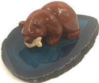 Stone carving of a bear on a polished agate slab 4