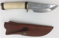 Fixed bladed knife with brass guard and end cap, b