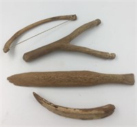 Lot of 4 bone implements including part of a bow d