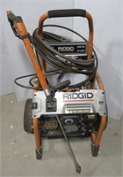 Ridgid 3300 PSI power washer with hose and wand.