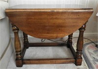Fruitwood drop leaf table with stretcher base