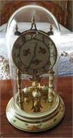 Kundo glass cased anniversary clock 10”