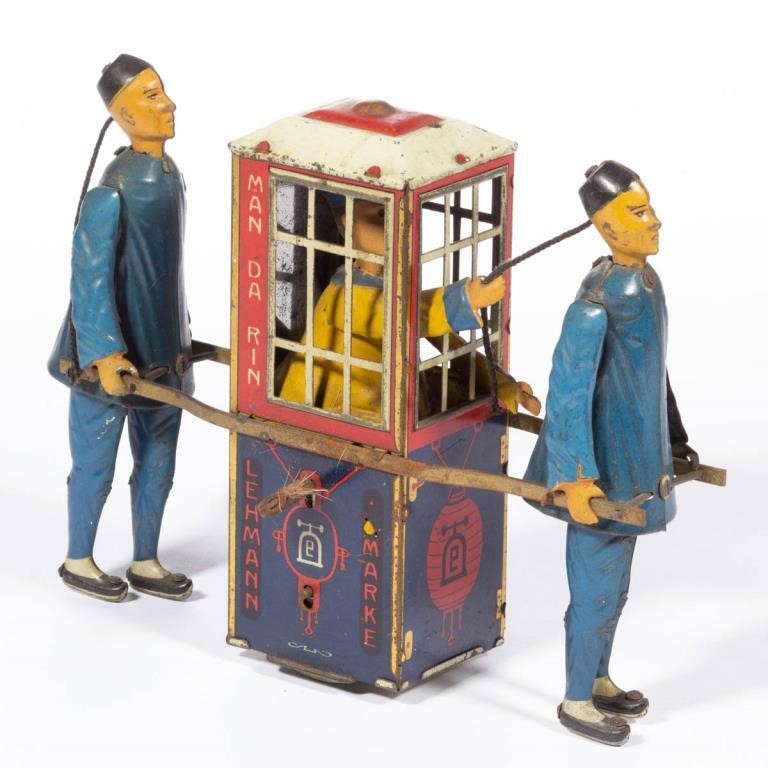 Toys of all types, including this Lehmann tin key-wind Man-Da-Rin toy