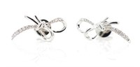 Diamond and 18ct white gold "bow" stud earrings