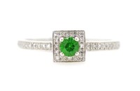 Green gemstone and diamond halo ring