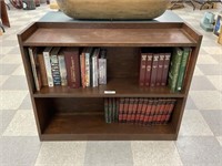 Pine bookshelf with an assortment of books