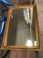 Gold-framed wall mirror, 24 x 36