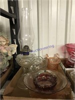 Pink dishes, glass baskets, bowls, kero lamp