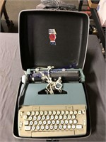 Smith-Corona electric typewriter in case, w/ book