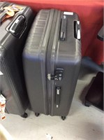 Large suitcase by navy club