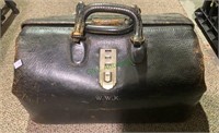 Antique black leather doctors bag with a snap