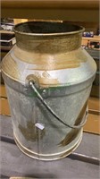 Vintage metal milk jug with a bail handle with