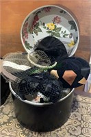 4 ladies hats in a vintage 1960s hat box with a